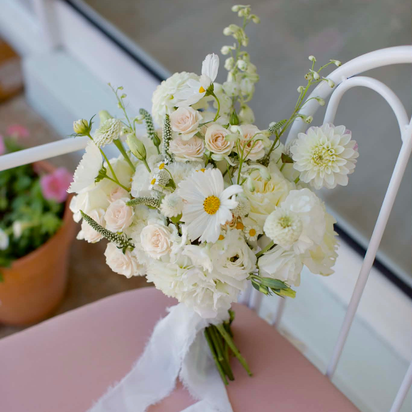 Romantic wedding bouquet resting on a bench, by Posy Mae Floral Studio Bundaberg Queensland wedding florist.