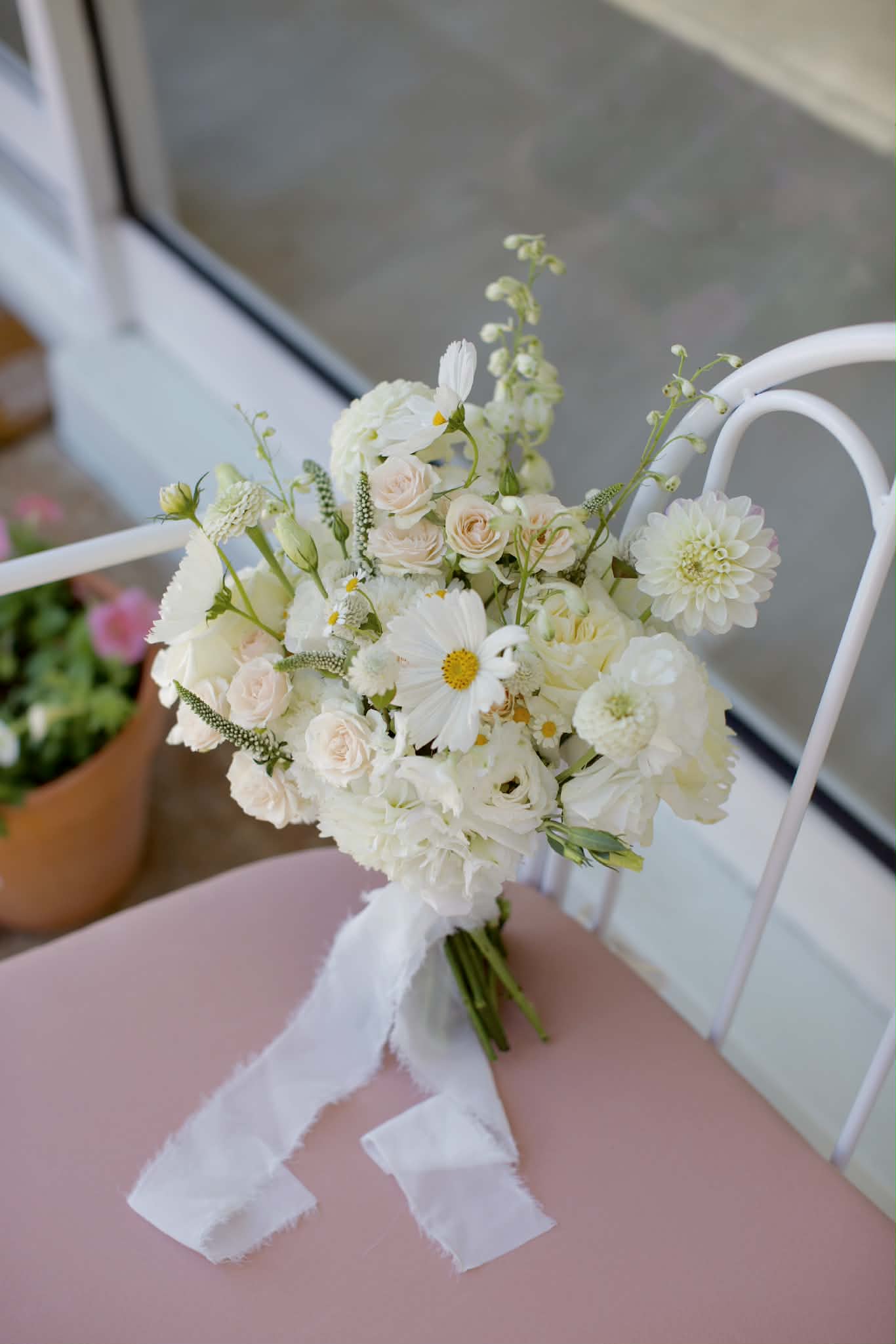 Romantic wedding bouquet resting on a bench, by Posy Mae Floral Studio Bundaberg Queensland wedding florist.